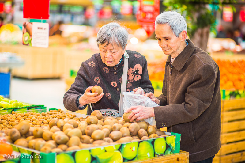 Senior Man and Woman Shopping Fruit